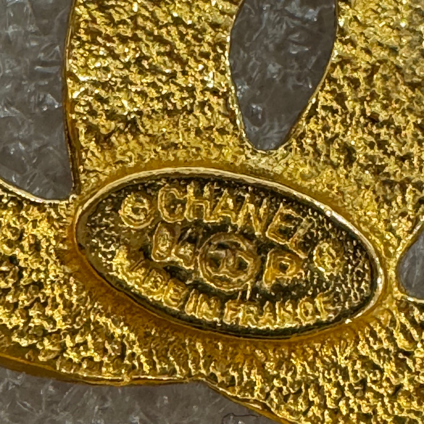CHANEL Gold toned CC Brooch/Pin