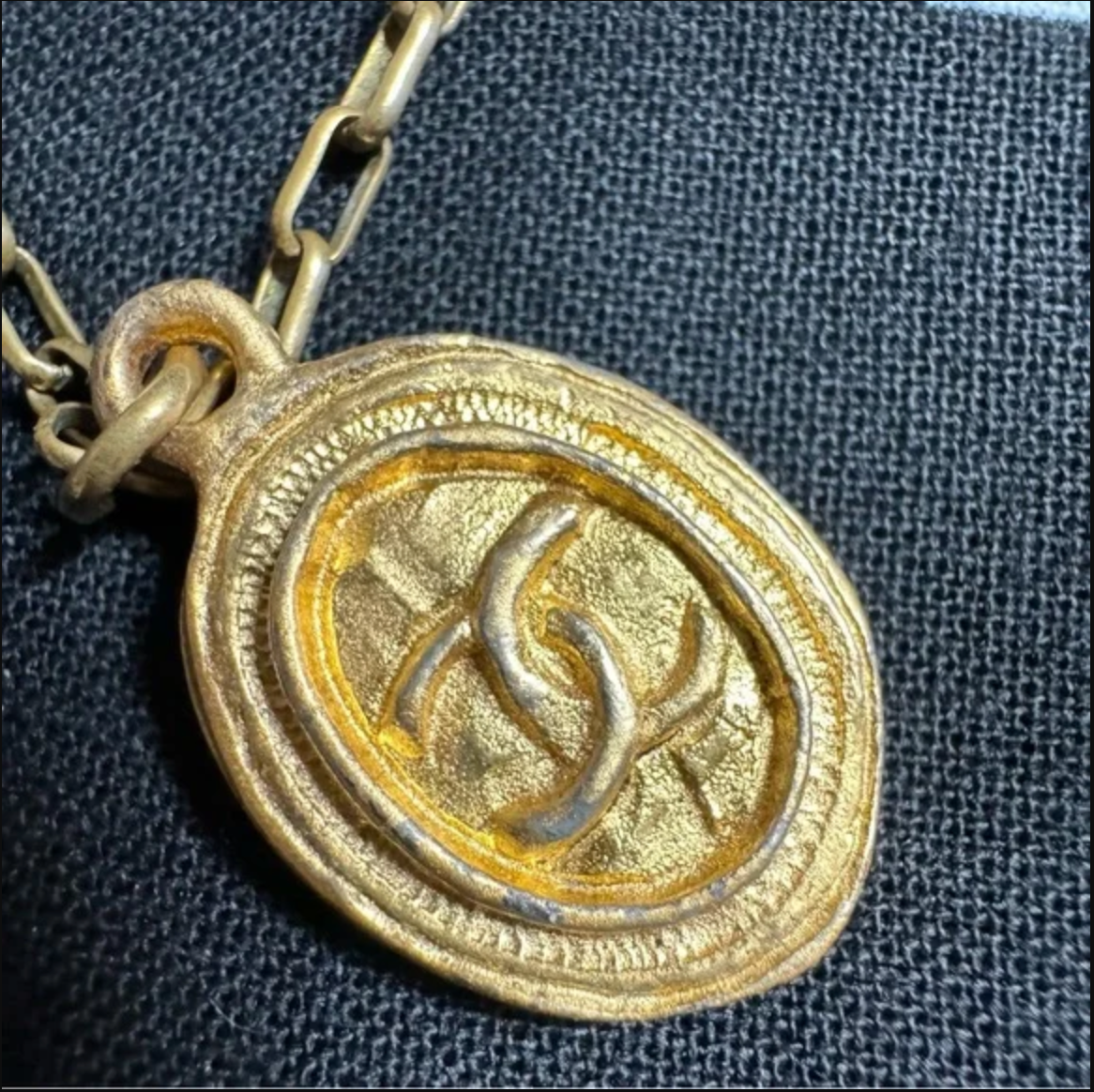 CHANEL gold toned CC logo charm and necklace