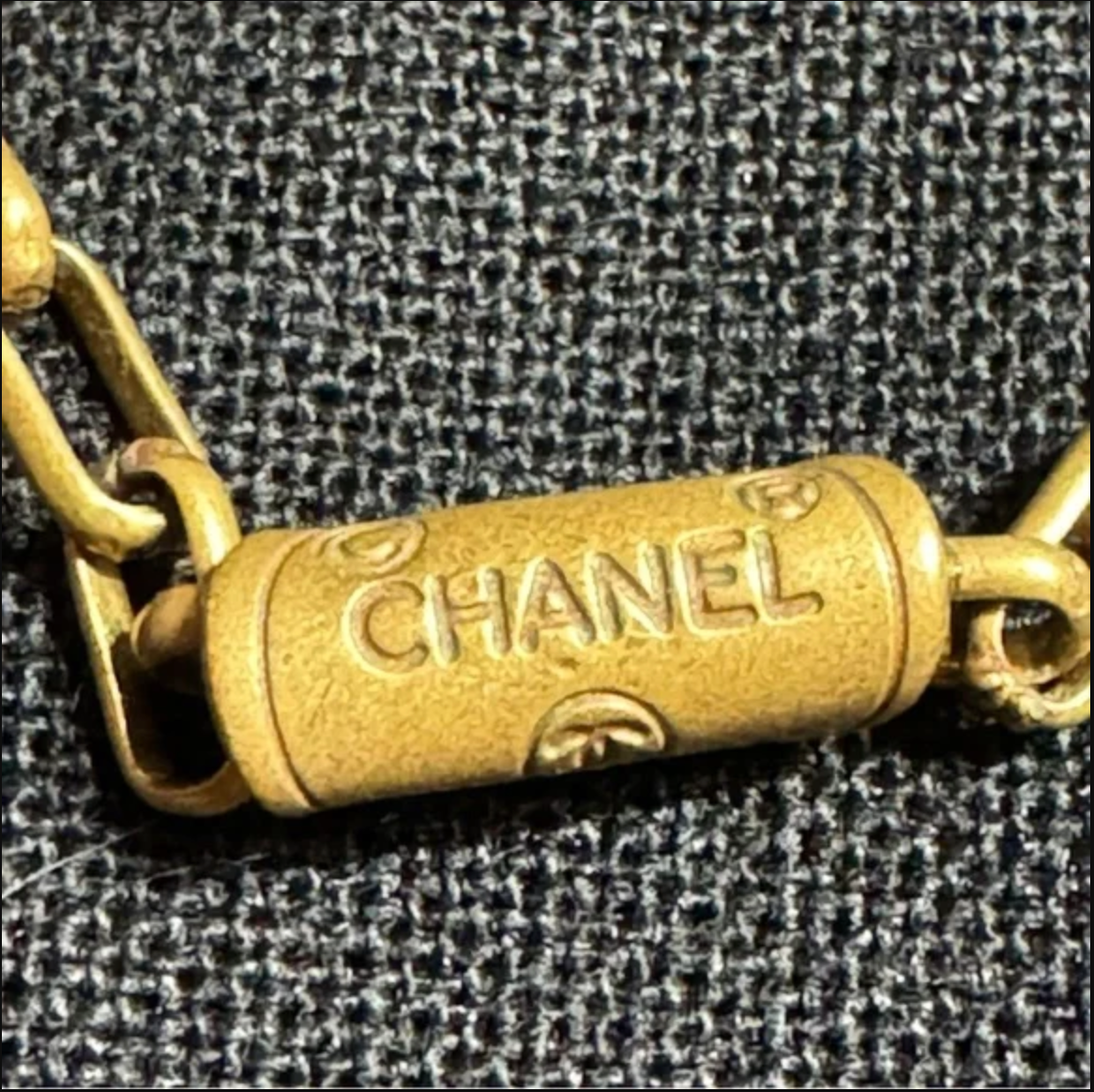 CHANEL gold toned CC logo charm and necklace