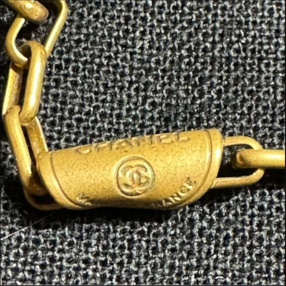 CHANEL gold toned CC logo charm and necklace