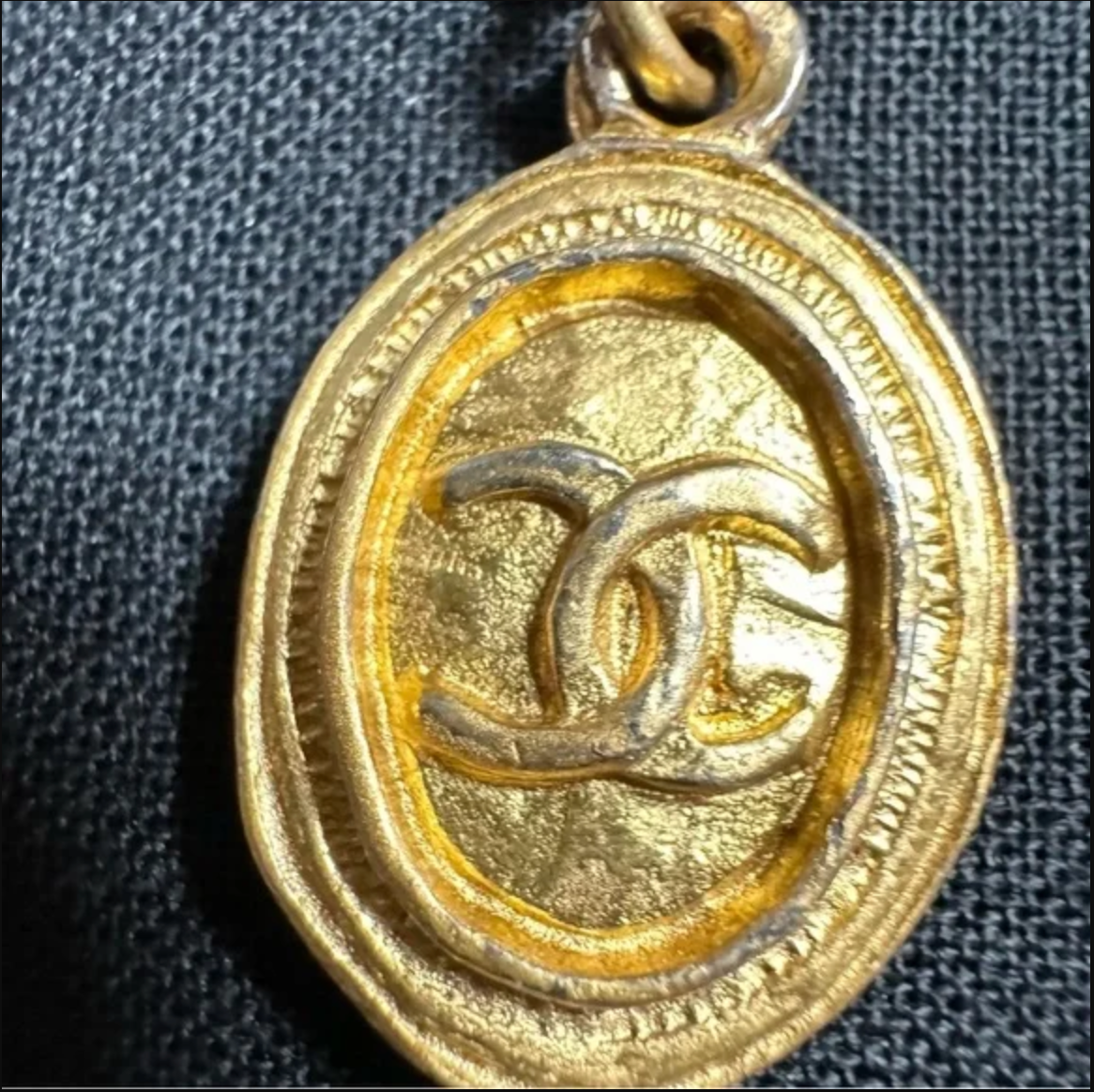 CHANEL gold toned CC logo charm and necklace