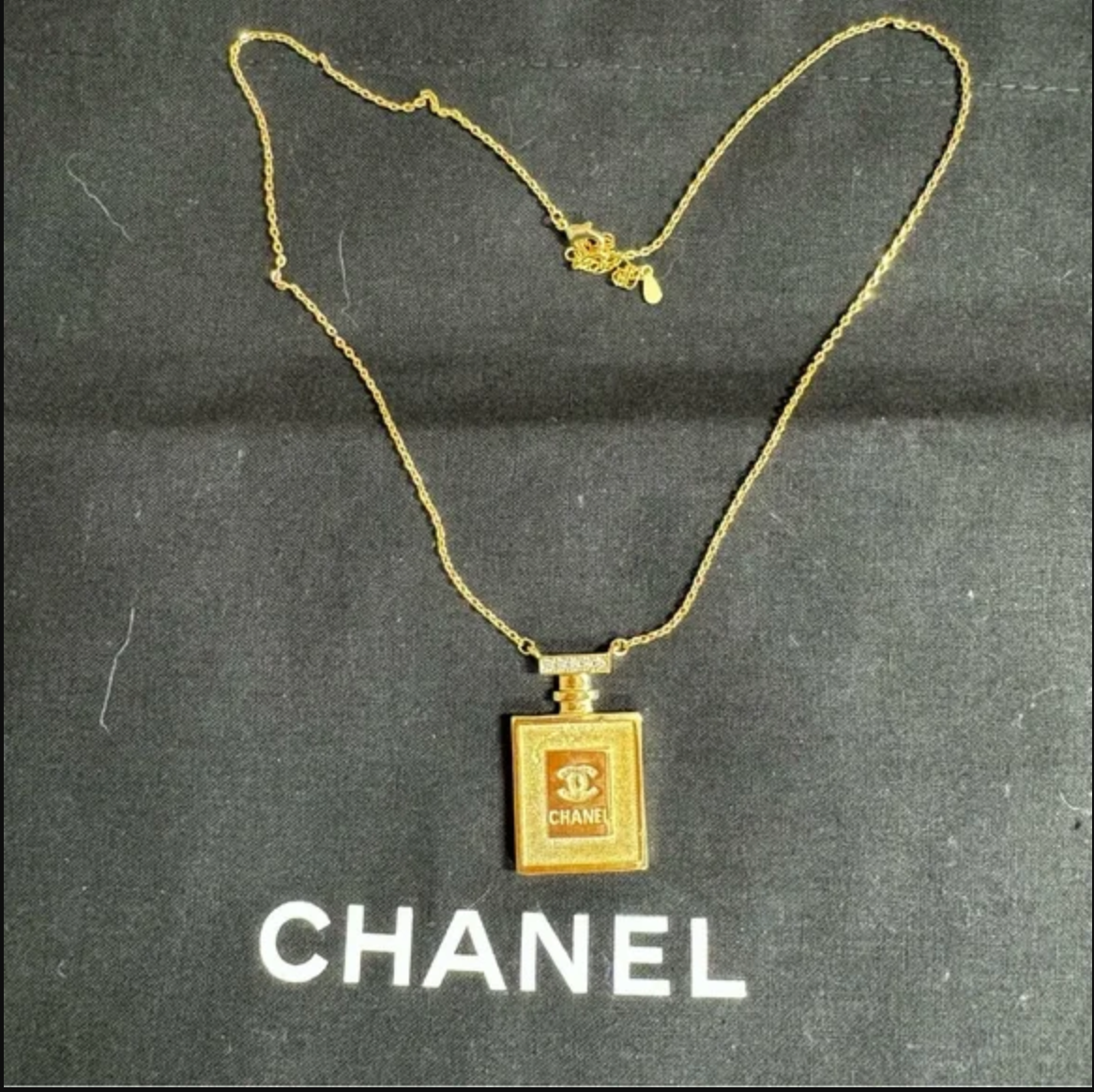 Authentic CHANEL gold toned perfume necklace
