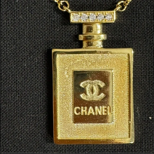 Authentic CHANEL gold toned perfume necklace