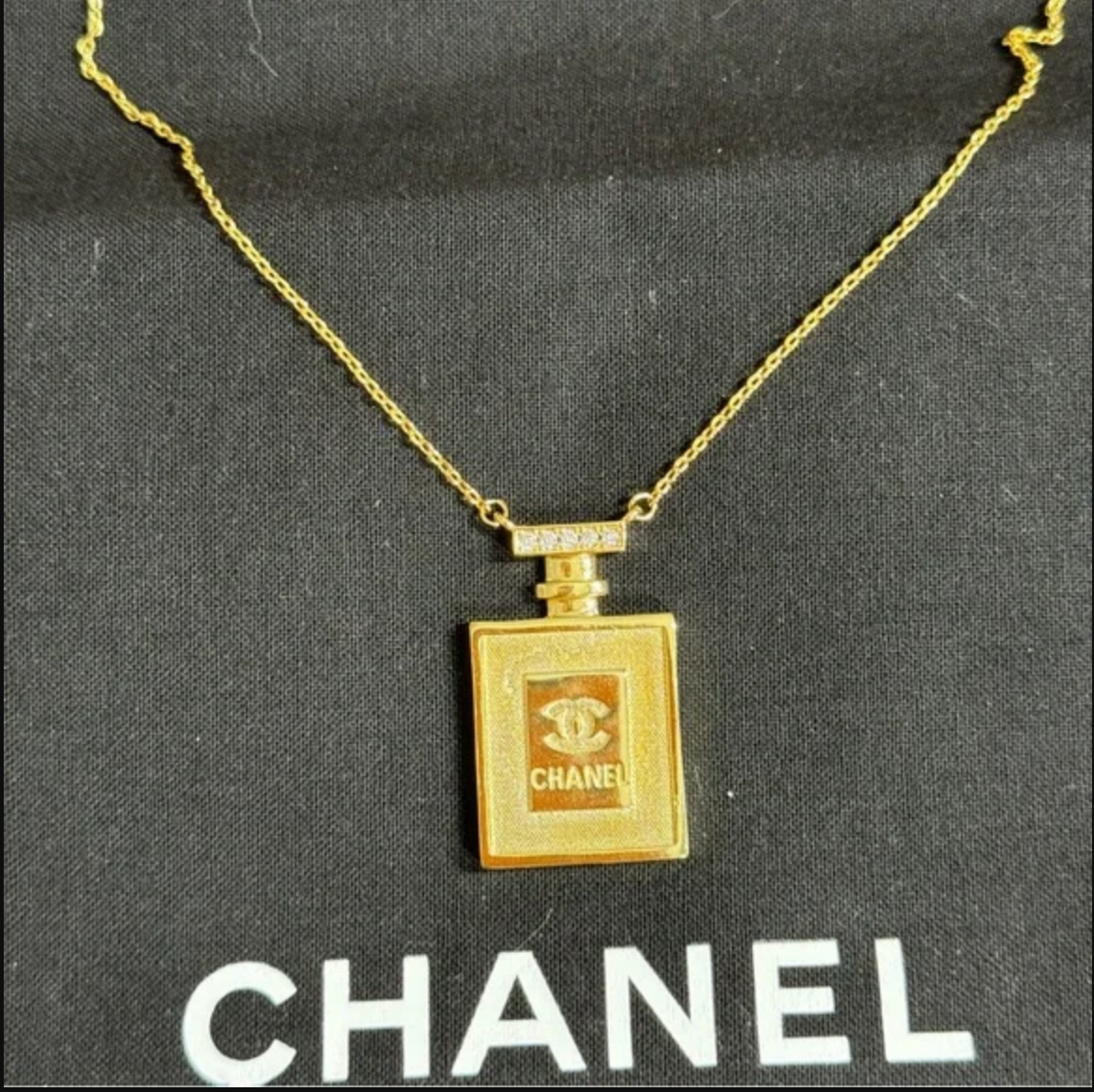Authentic CHANEL gold toned perfume necklace