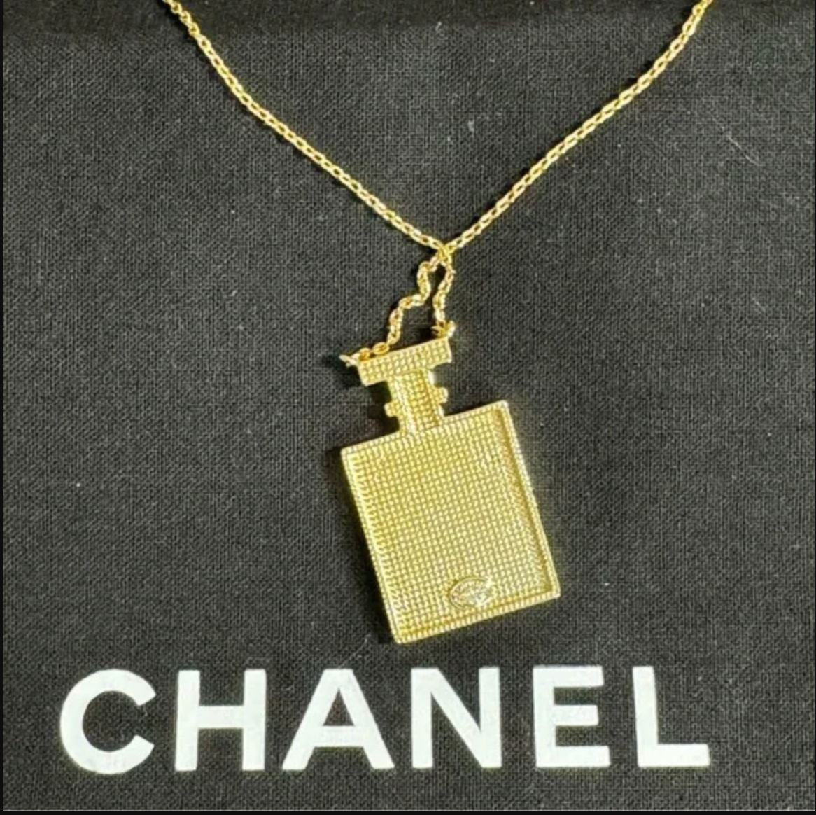 Authentic CHANEL gold toned perfume necklace