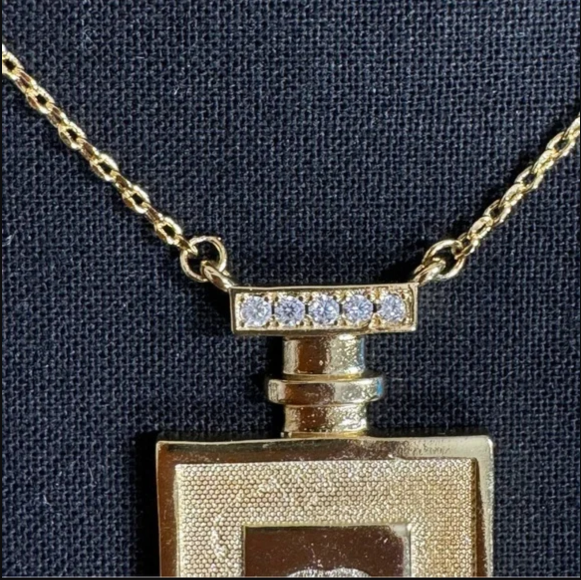 Authentic CHANEL gold toned perfume necklace