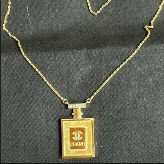 Authentic CHANEL gold toned perfume necklace