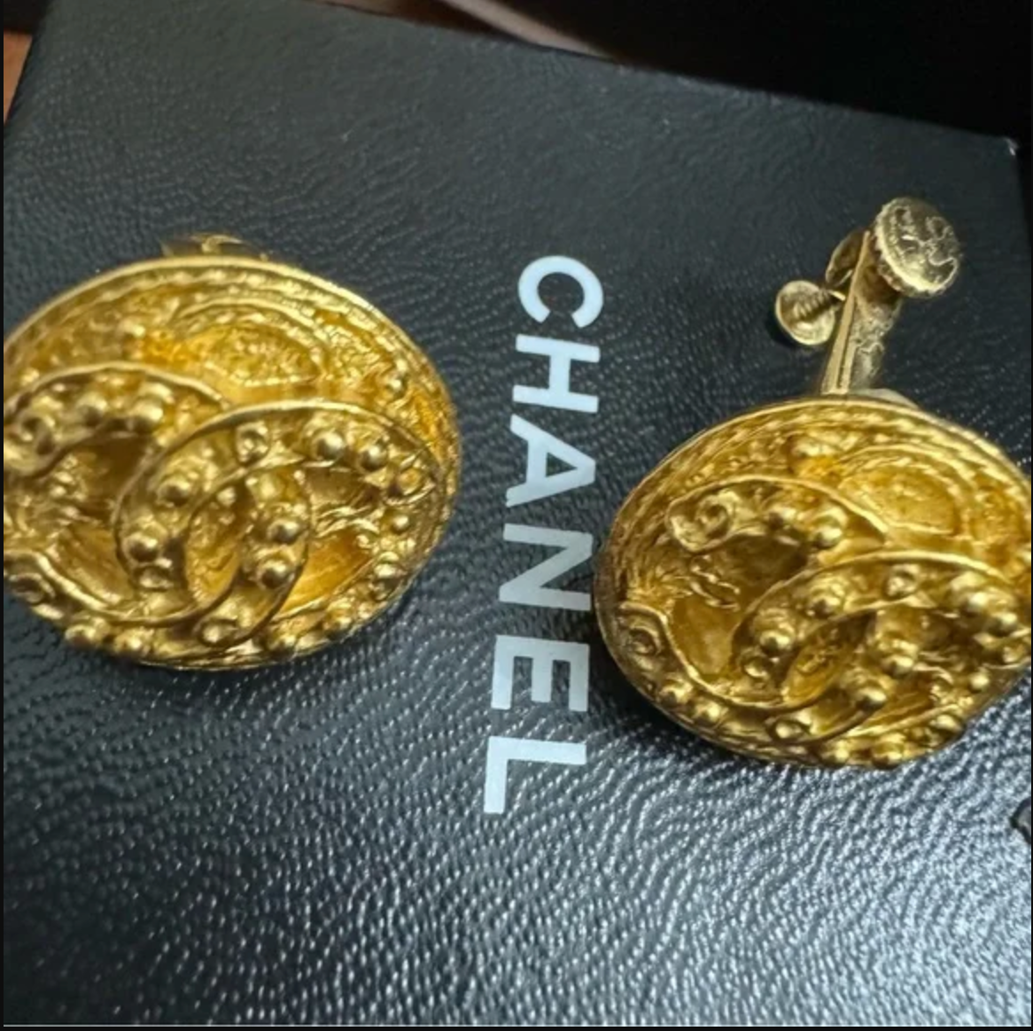 CHANEL EARRINGS. Gold toned clip-ons
