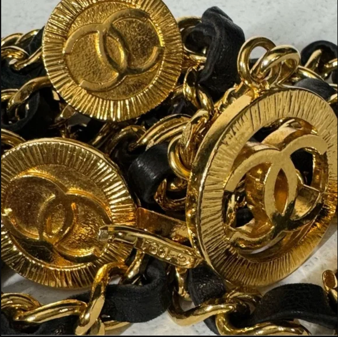Authentic CHANEL gold toned and black leather necklace / belt.