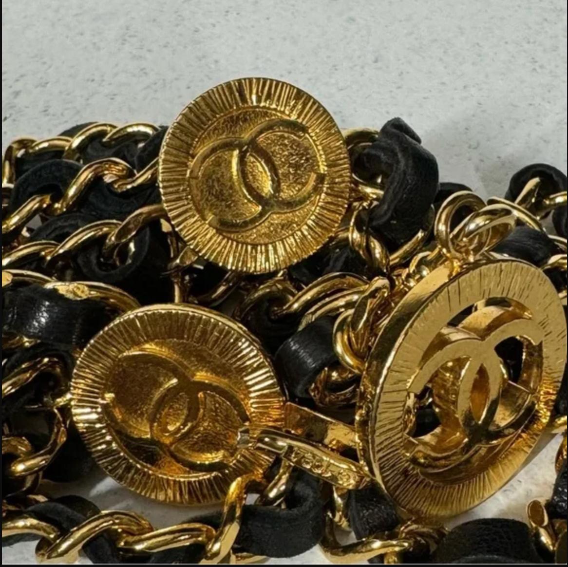 Authentic CHANEL gold toned and black leather necklace / belt.