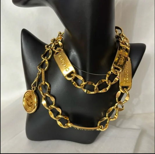 CHANEL gold toned necklace approx. 30 inches long.